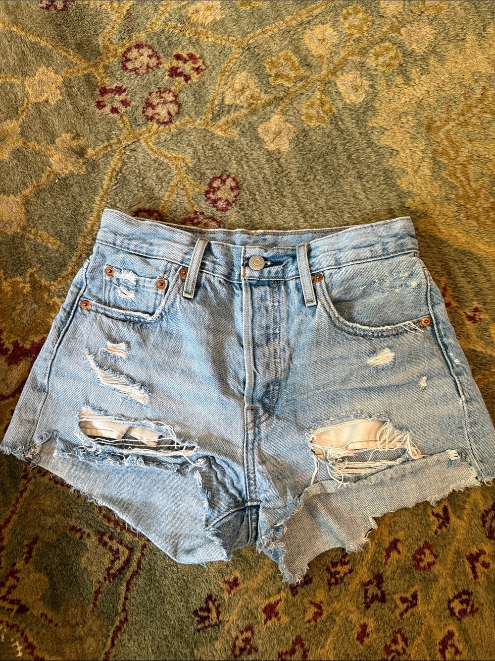 Levi’s 501 High-Waisted Light Blue Distressed Denim Shorts, size 25